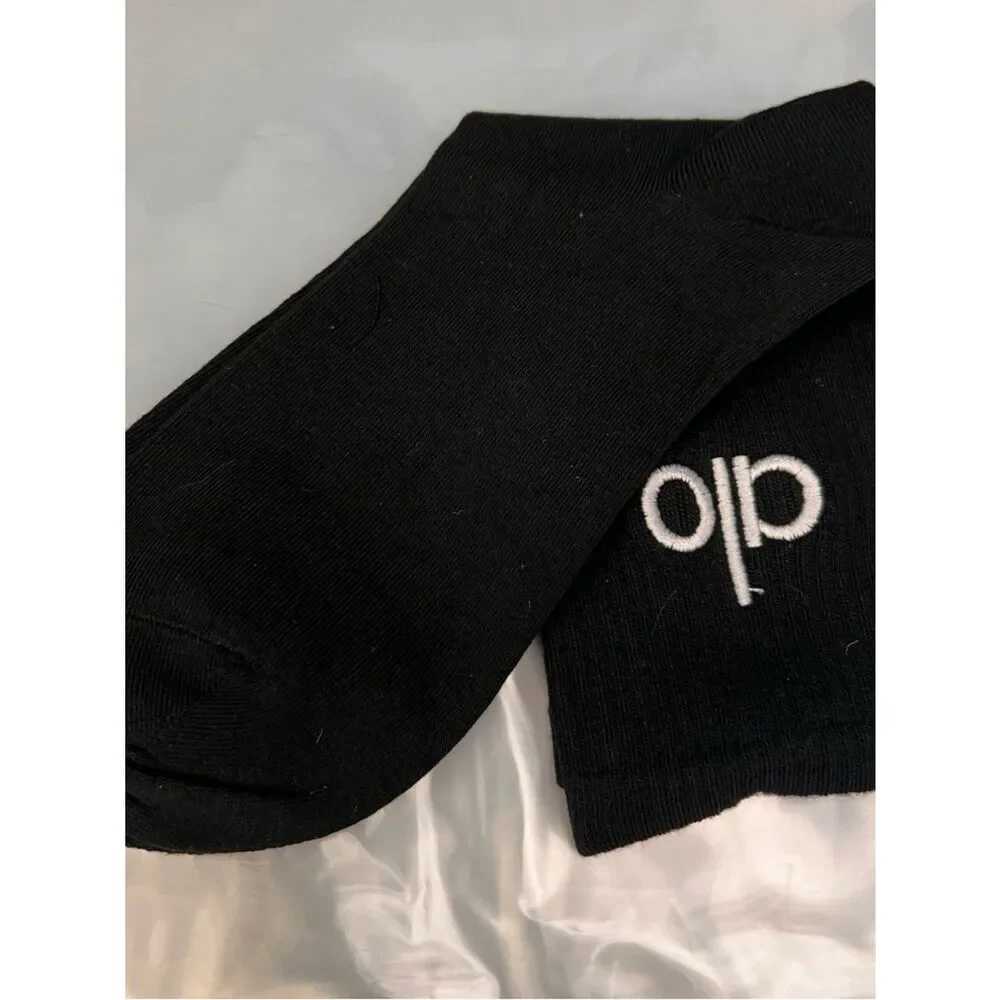ALO Yoga unisex half crew understated socks in gray embroidered logo